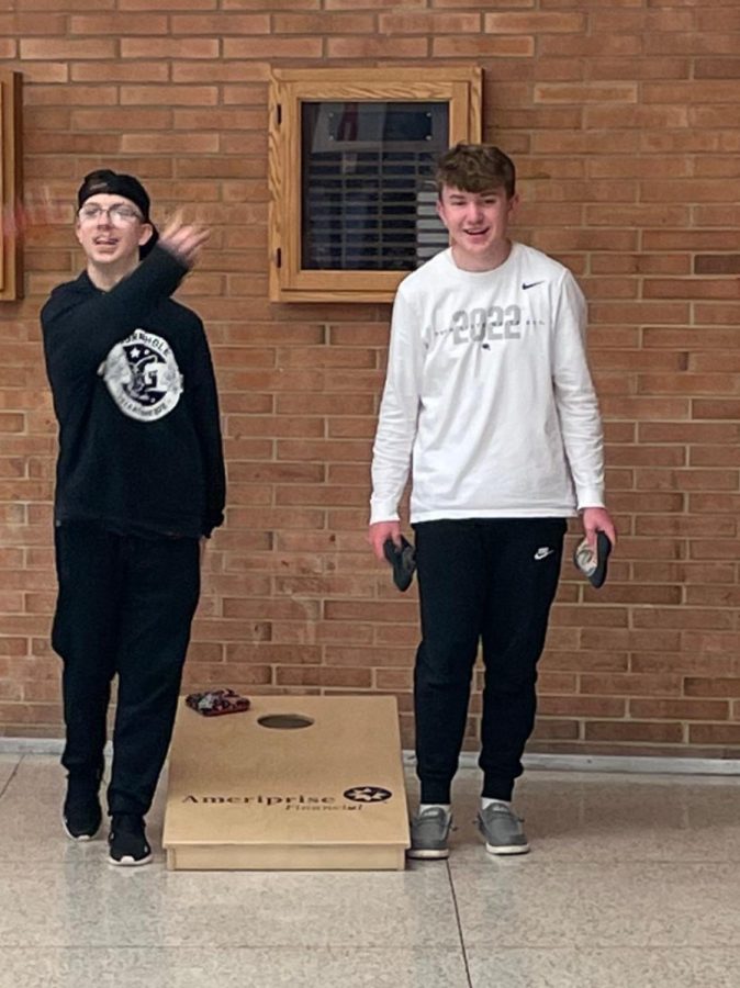 Students gather after school for cornhole