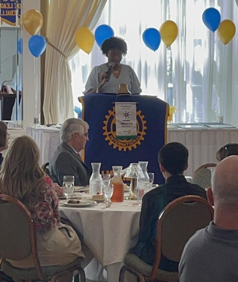 Robinson delivers speech at Rotary luncheon. 