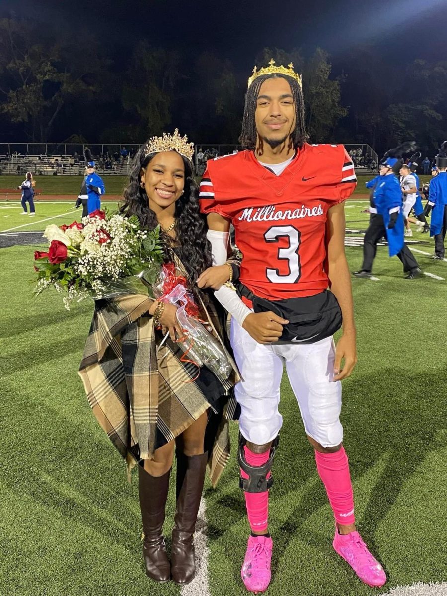 Homecoming Queen Sa'niyah Batten and Homecoming King Kyreek Bradshaw pose after they were crowned at the football game.